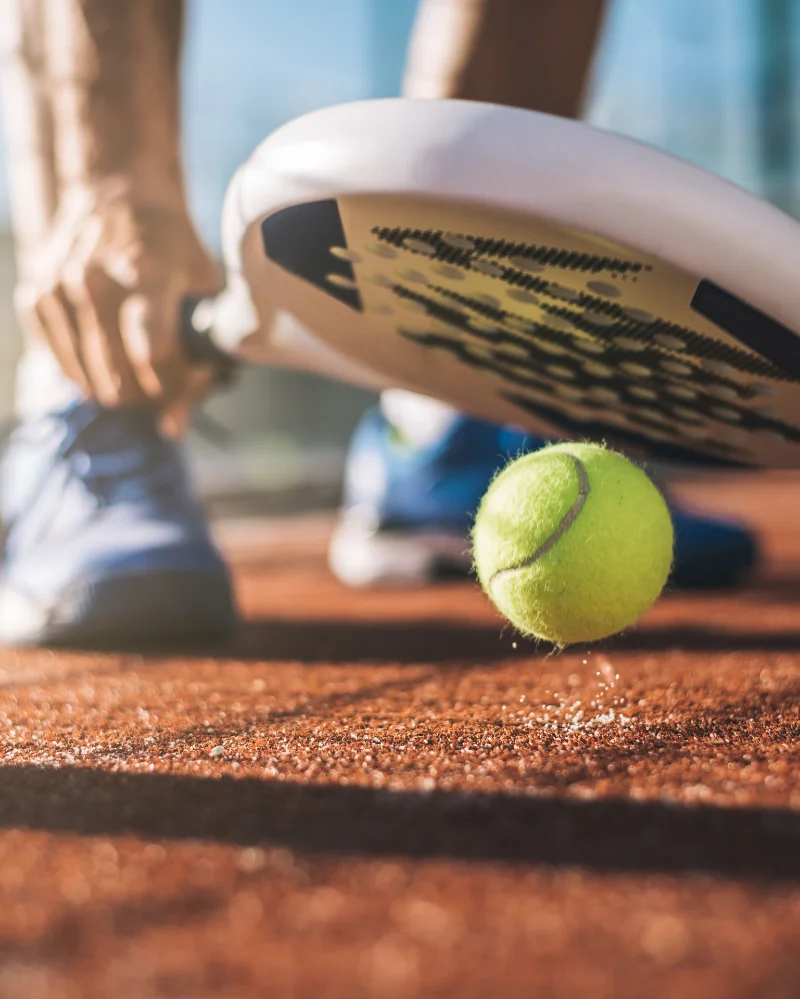 Close-up of a padel racket on court